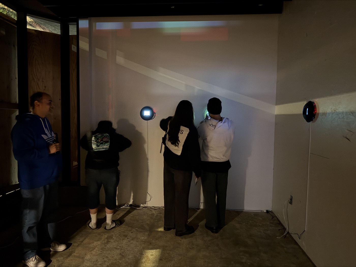 Visitors viewing light orb installation